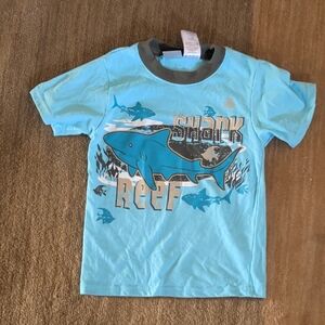 rebels Light Blue Kids Tee with Dark Gray Collar and Red Logo